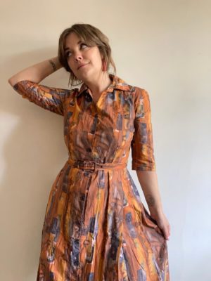 Vintage 1950s belted brown shirt dress made from abstract printed cotton