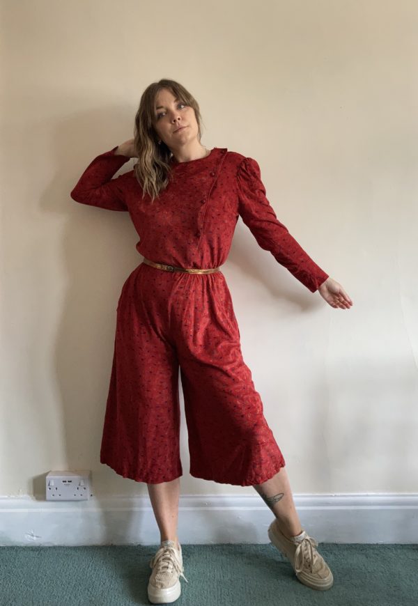Cropped 1980s red patterned velour jumpsuit with asymmetric neckline