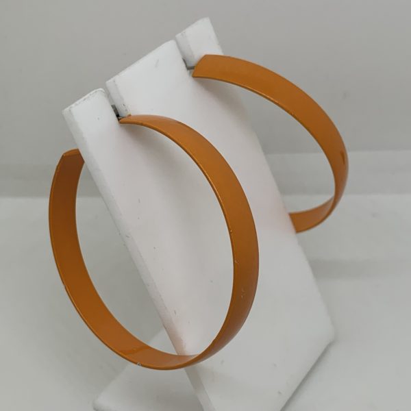 Large orange metal hoop earrings 1
