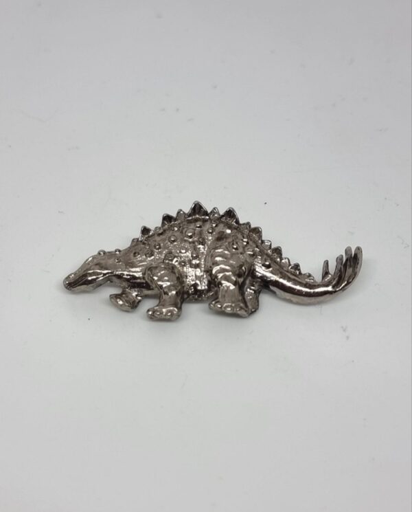 Vintage silver toned Stegosaurus brooch 1